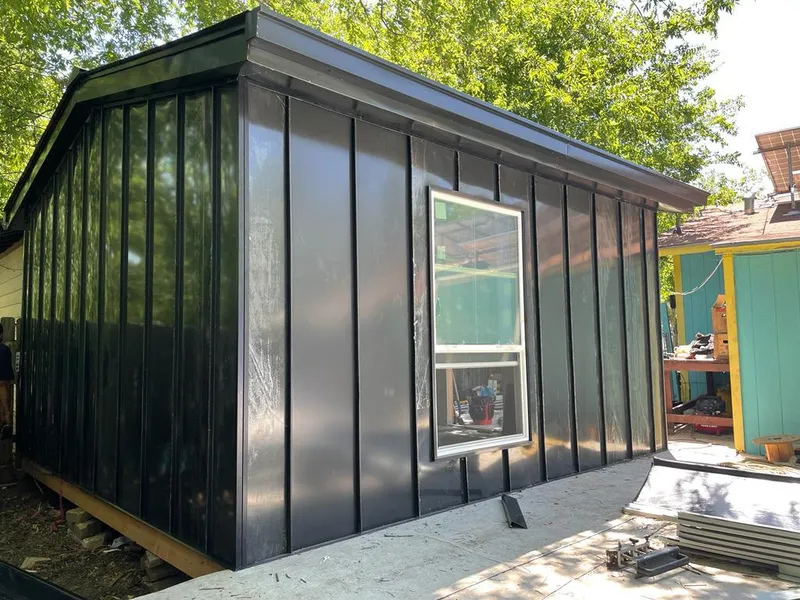 Black standing seam metal wall panels for Roof Inspection in Norcross