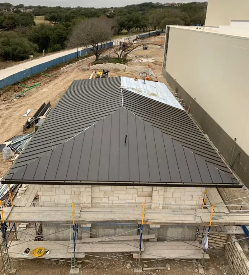 Metal roof new construction with scaffolding in Norcross